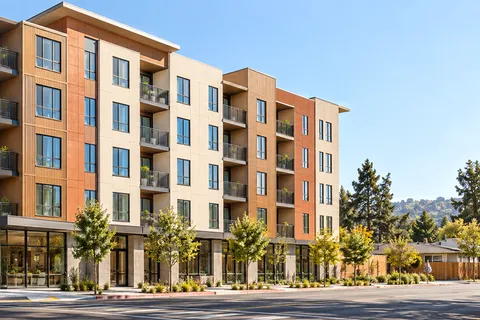 Illustrative banner: modern affordable apartment mid-rise representing the Residences at Liberation Park story - not a photograph of the actual development